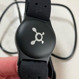 Only used twice ORANGETHEROY wristband, charger and extra strap